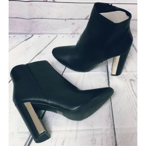 Black booties with metallic heel